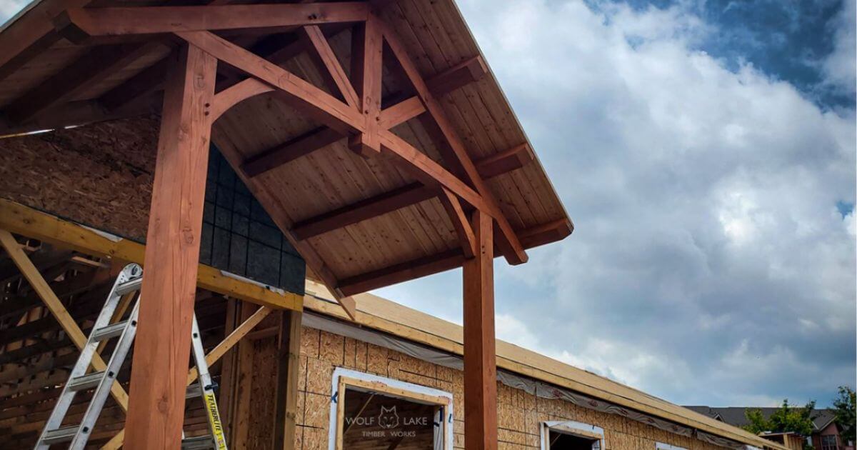 Timber frame entrance under construction.